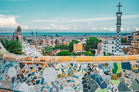 The mosaic terrace at Park Güell looking out over Barcelona to the sea